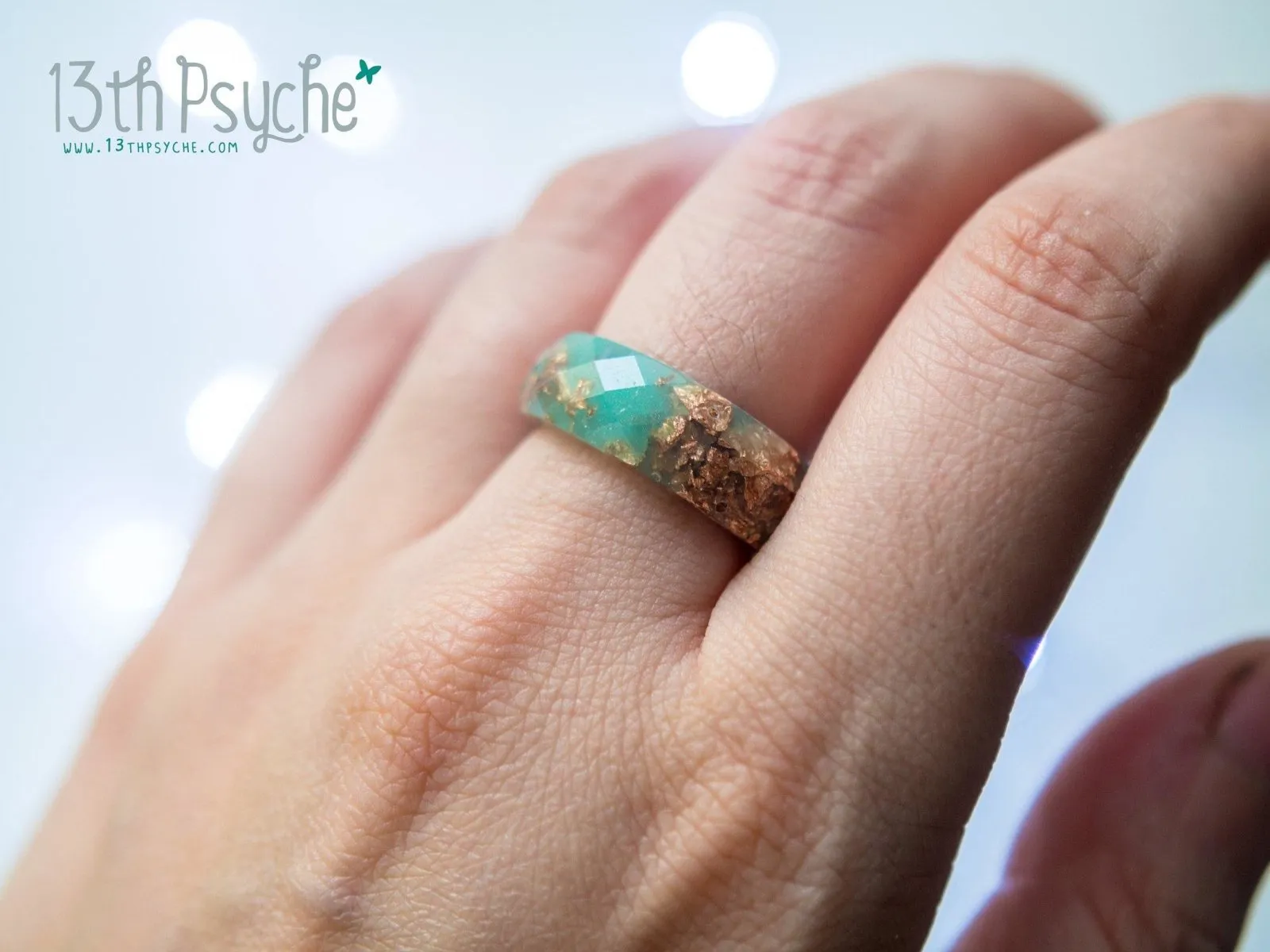 Aqua faceted resin ring with rose gold flakes