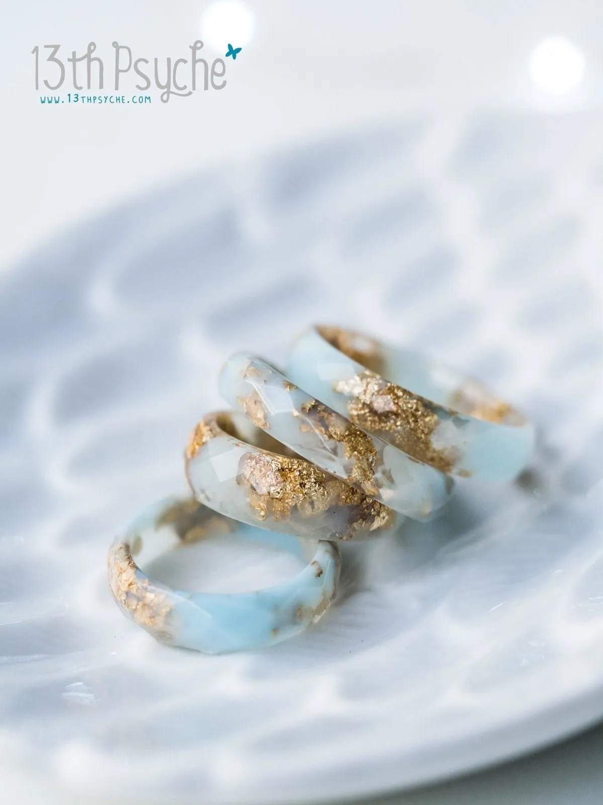 Clear and Pale blue faceted resin ring with gold flakes