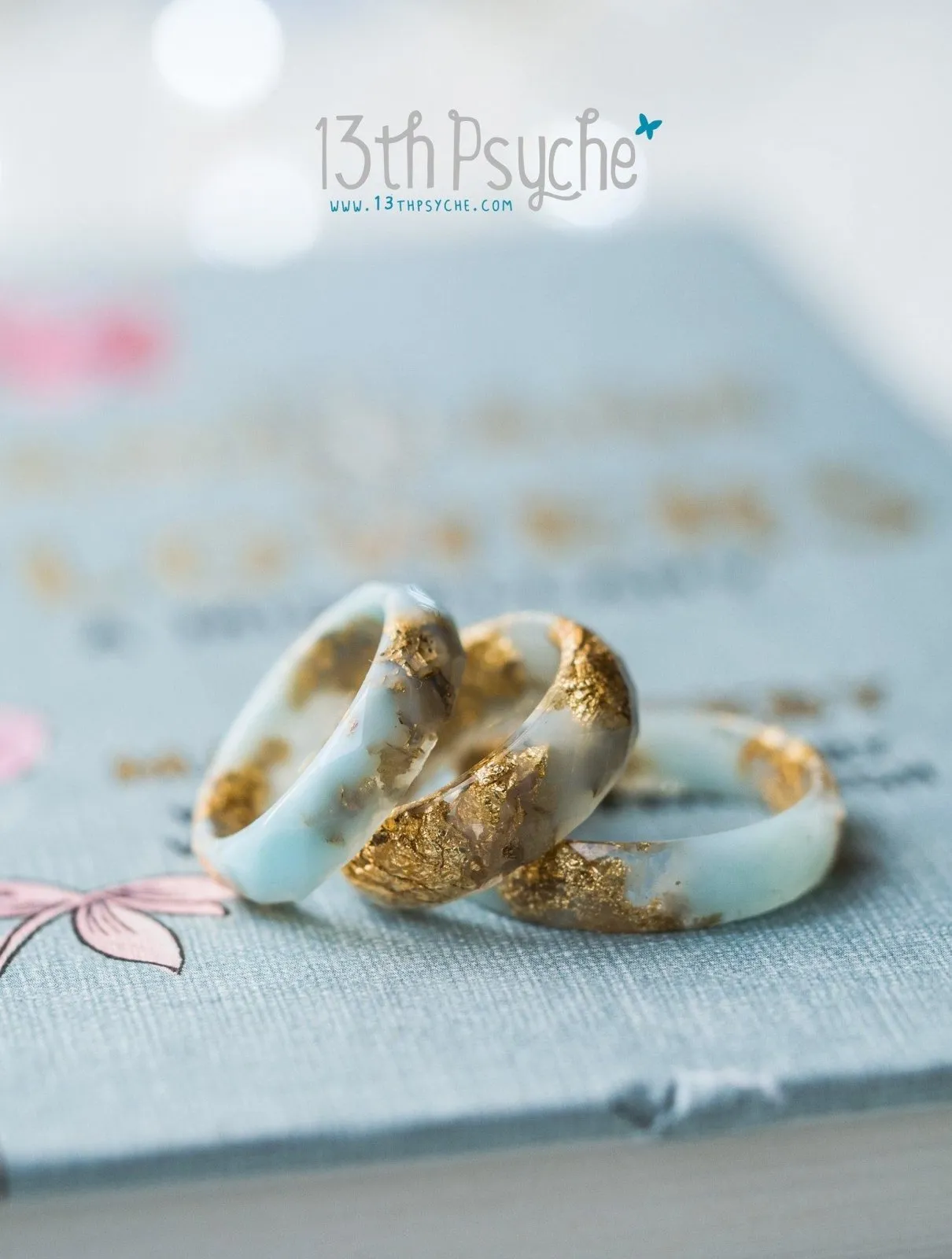 Clear and Pale blue faceted resin ring with gold flakes