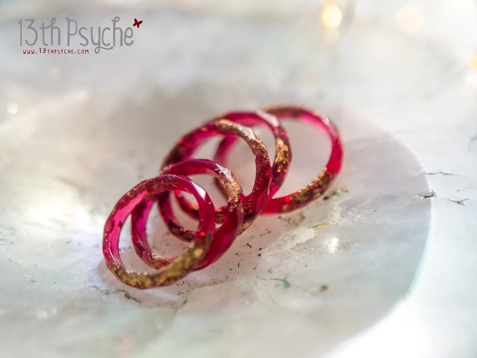 Dark red and gold flakes faceted resin ring