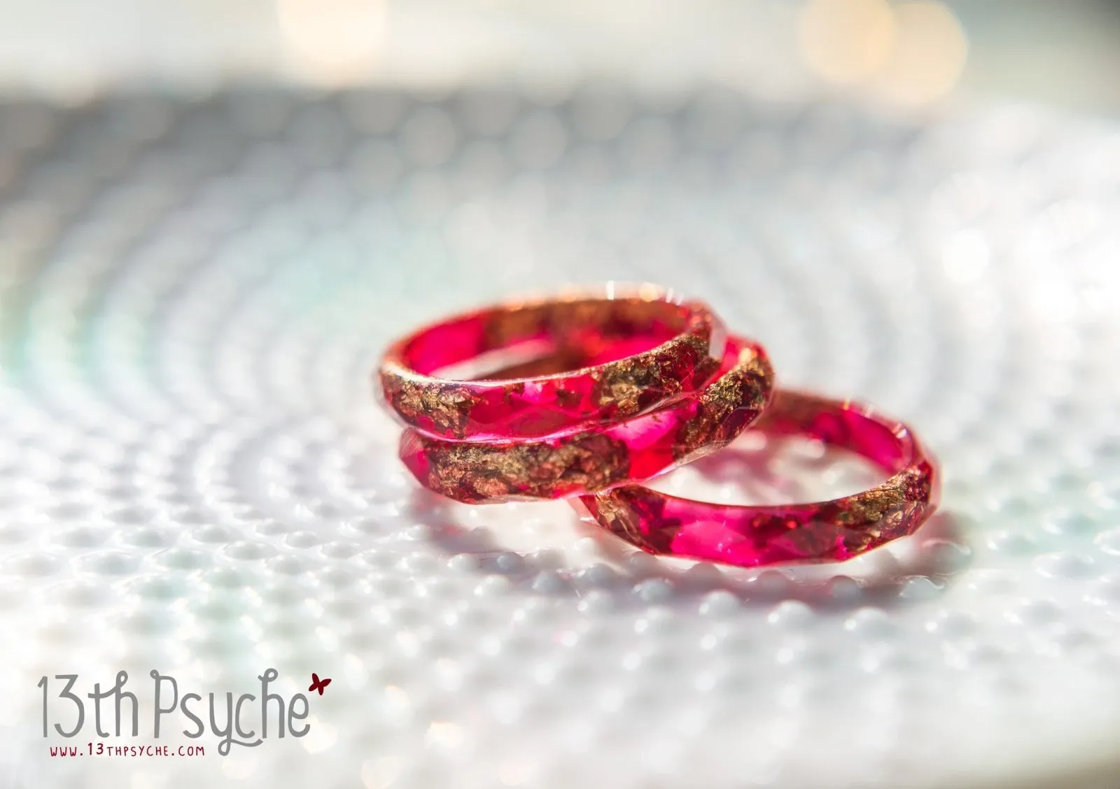 Dark red and gold flakes faceted resin ring