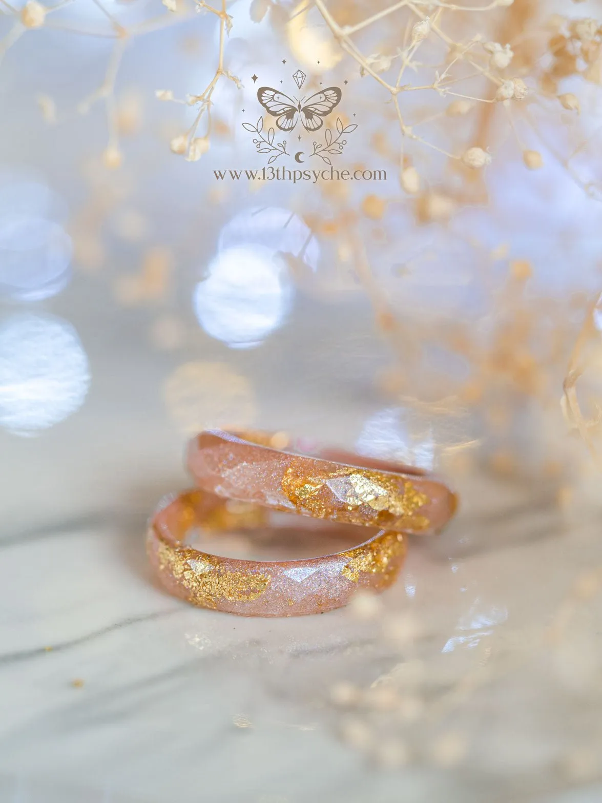 Iridescent pink faceted resin ring with gold metal flakes